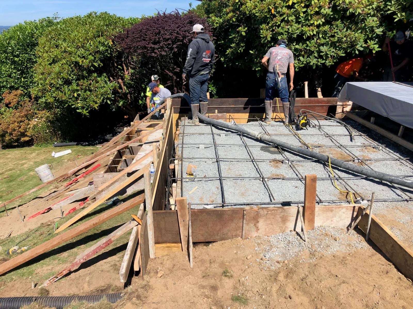 Concrete foundation pour with steel rebar reinforcement and wooden forms on residential lot